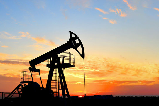Oil pump jack at sunset